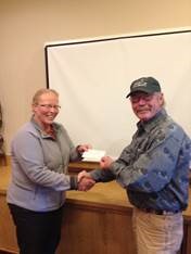 Barb North, President of the Portneuf Valley Audubon Society presents Tim Reynolds, President of Friends of Camas National Wildlife Refuge with a $500 check to support Friends’ education and conservation work at the refuge